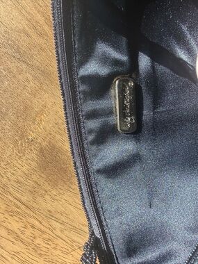 Beaded  purse from Inge Christopher features multiple purses on both sides.